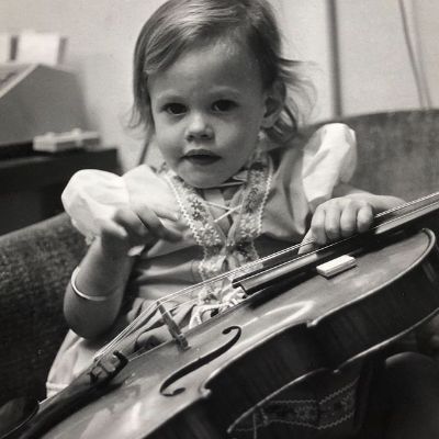 Katherine Moennig's childhood photo while holding a violin.